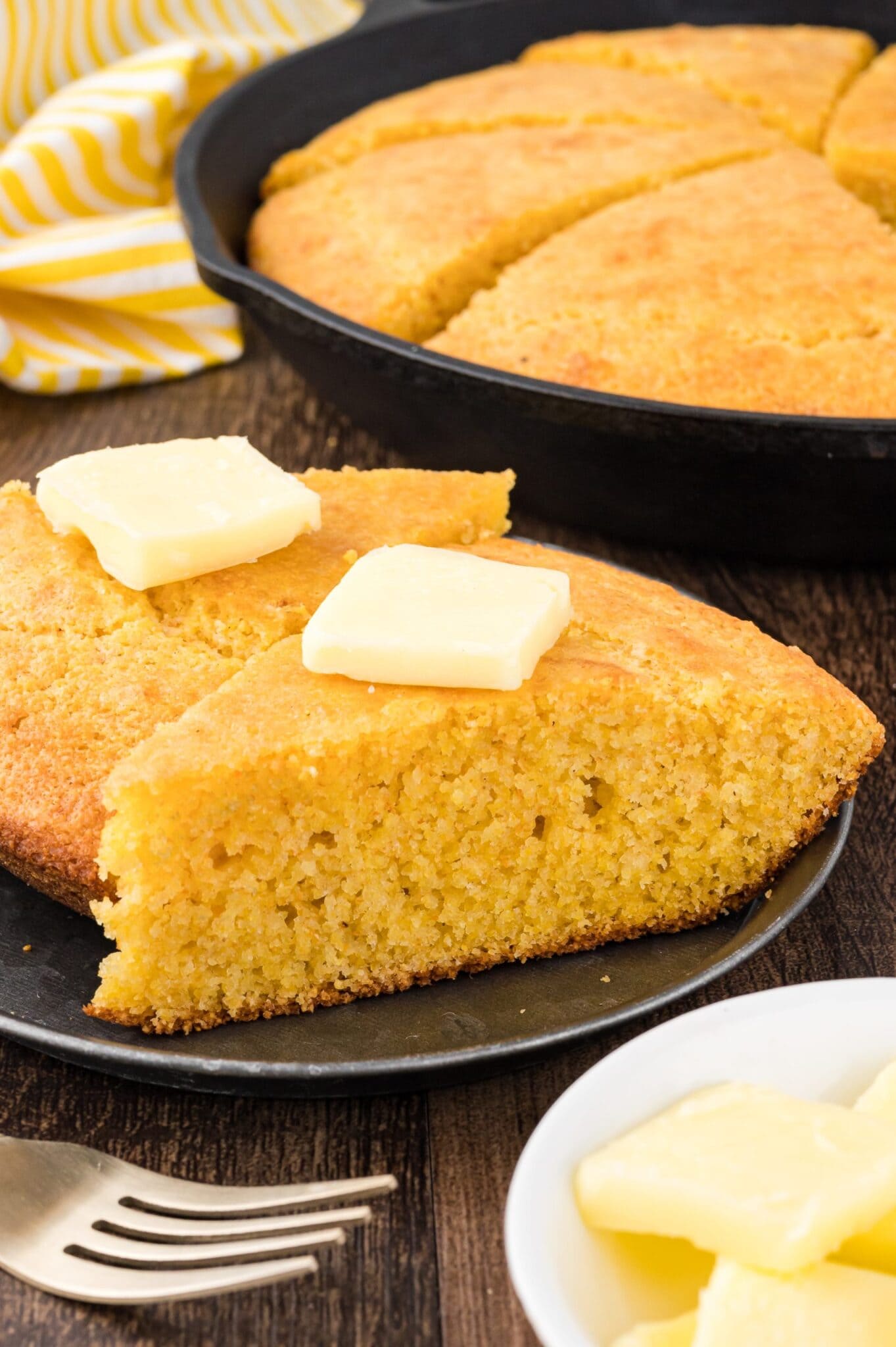 plated cornbread with butter on top