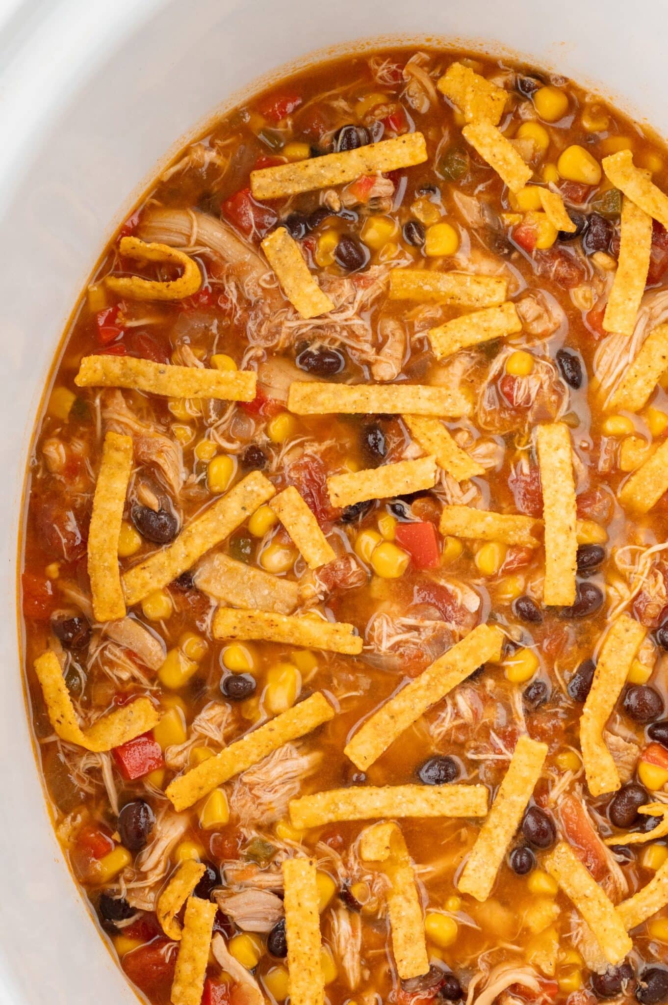 Up Close picture of chicken tortilla soup in the slow cooker