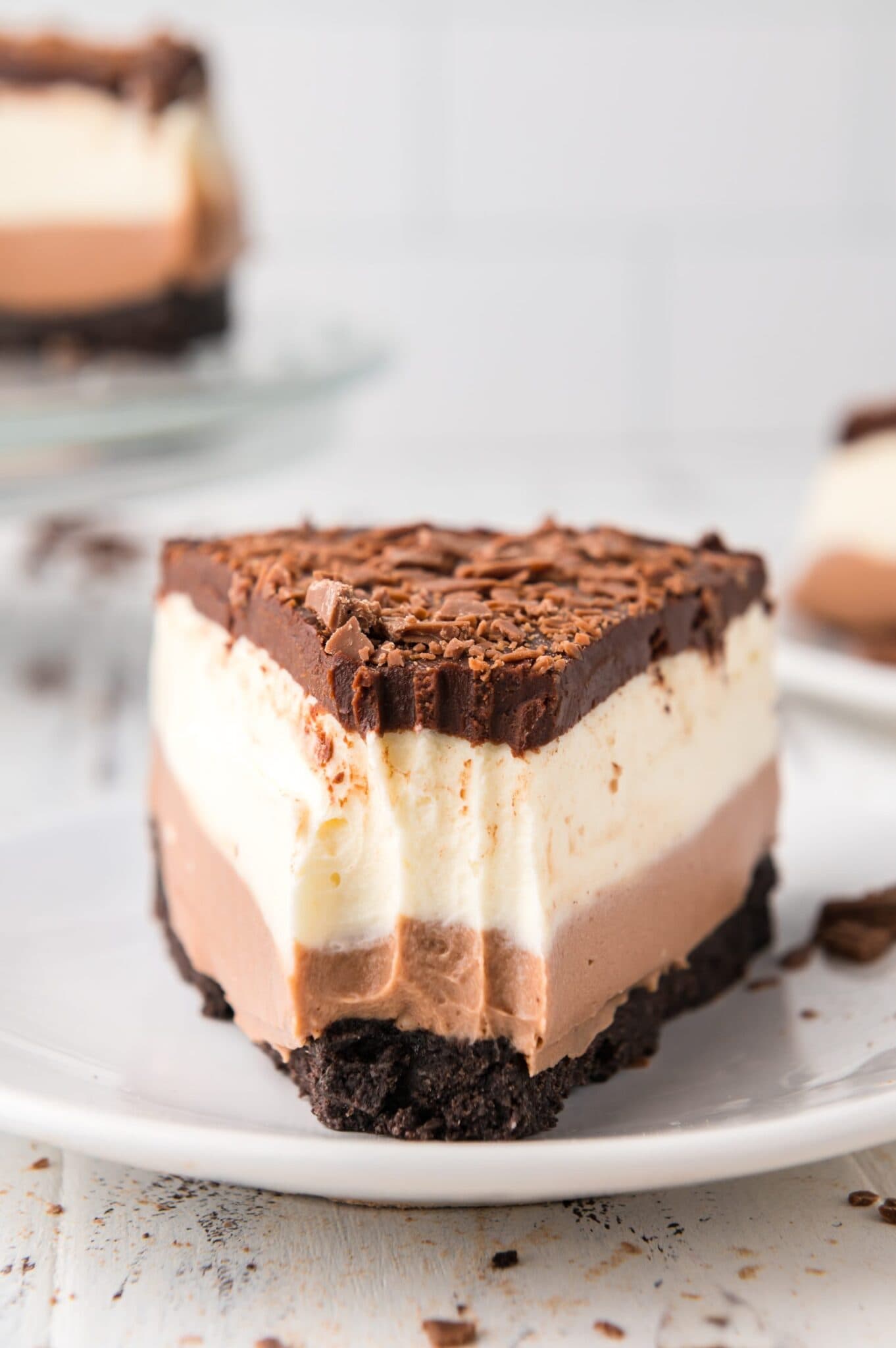 up close of a fork full taken out of a slice of layered Chocolate Cheesecake