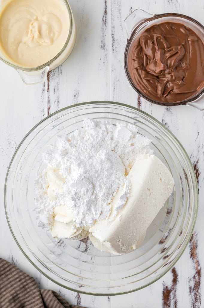 mixing cream cheese with powdered sugar