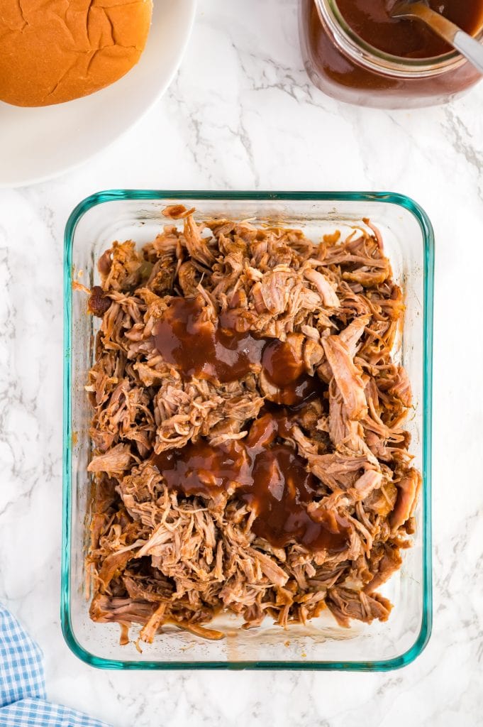 pulled pork with bbq sauce poured ontop