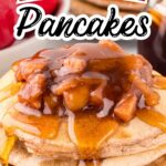 Homemade apple pie pancakes layered in a tall stack and topped with cinnamon-spiced apples and maple syrup.