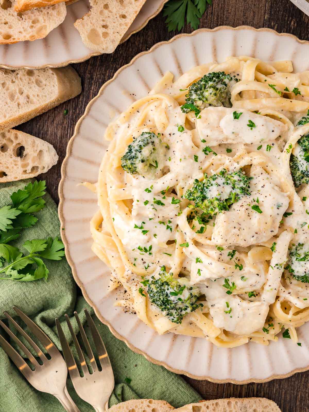 Up close of a plate with Chicken and Broccoli Alfredo on it.