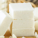 A Stack of coconut fudge with some leaning up against the stack.