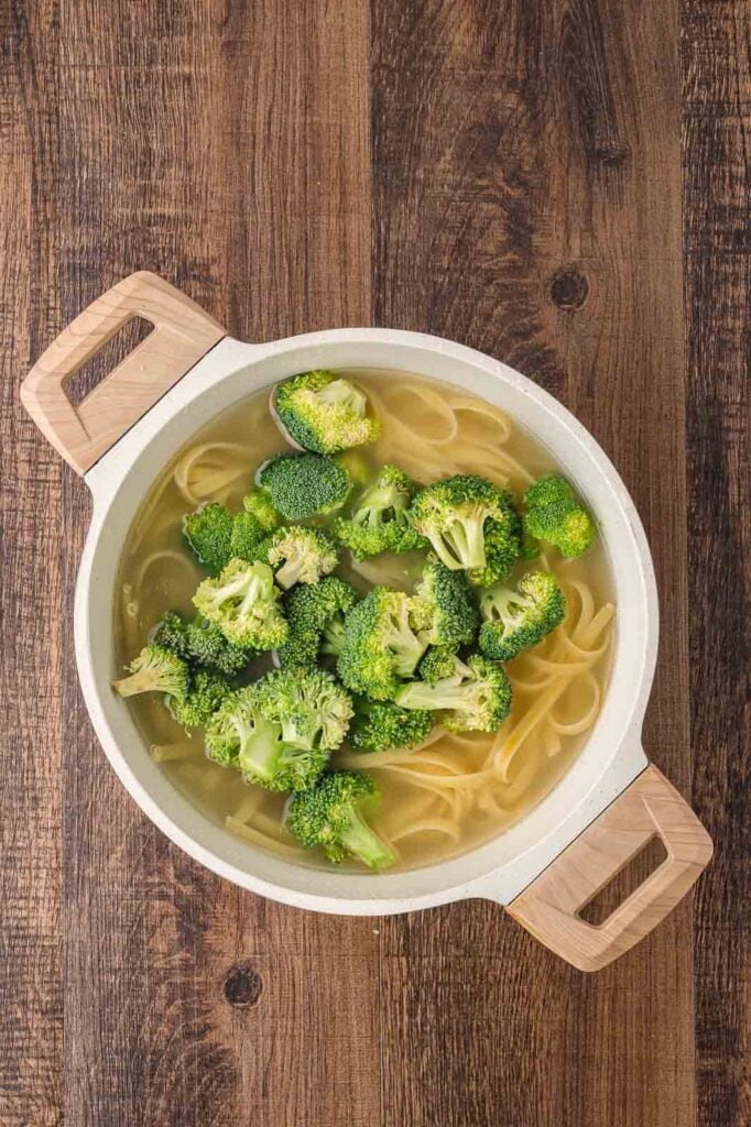 Pasta and Broccoli cooked in a pot.