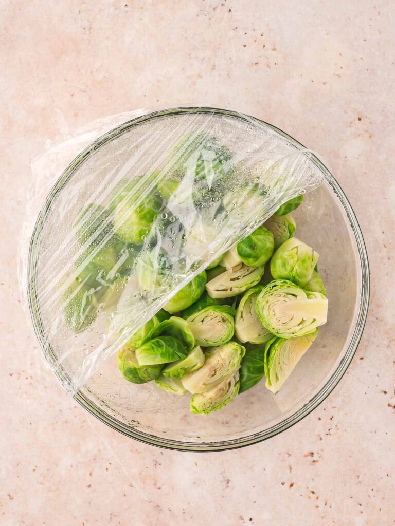 A bowl of brussels sprouts after being steamed in the microwave.