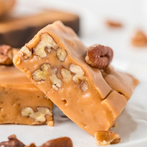 butterscotch pecan fudge leaning against each other.