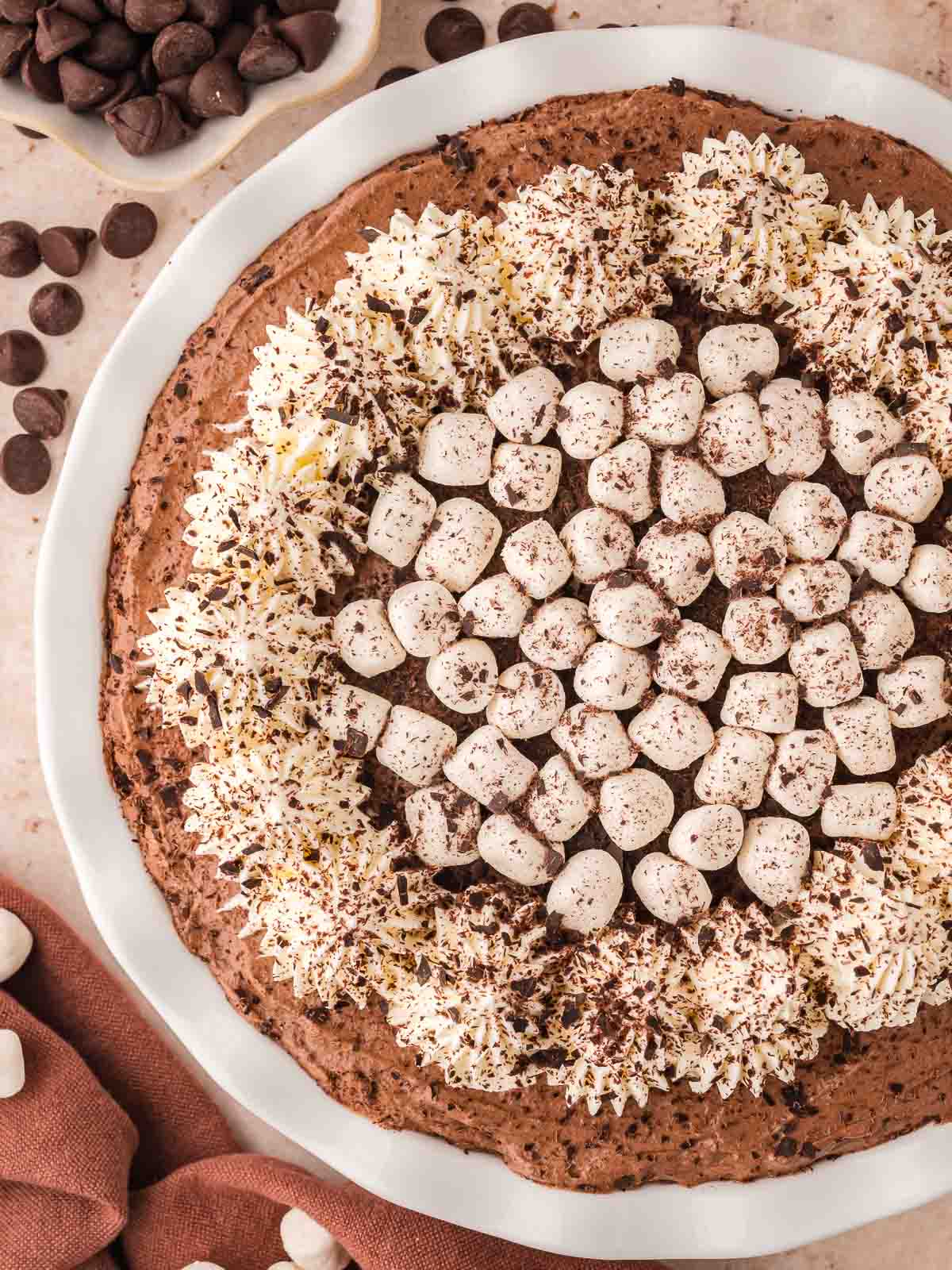 Over head picture of the Hot Chocolate Pie with whipped cream, marshmallows and shaved chocolate.