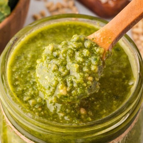 Up close of Kale Pesto on a wooden spoon.