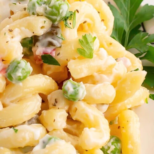 Up close of Macaroni Salad in a white bowl.