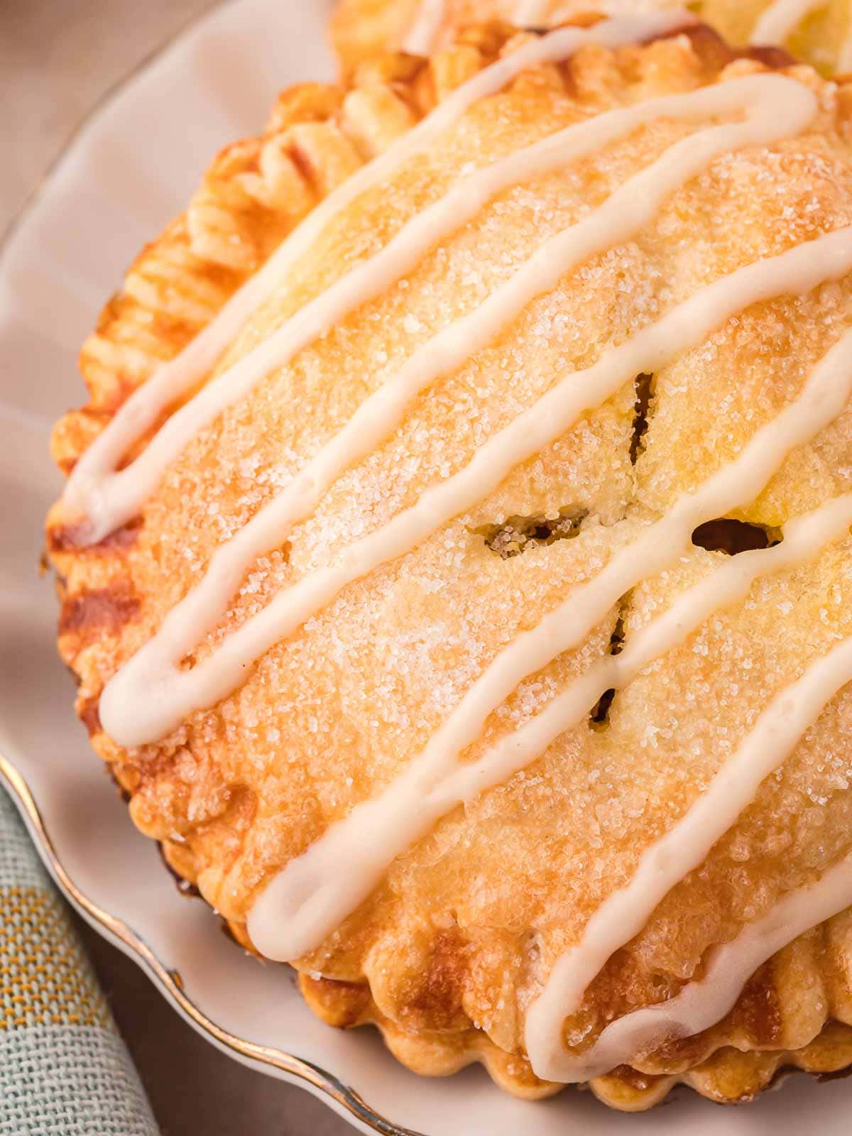 Up close of Pumpkin hand pies with maple glaze.