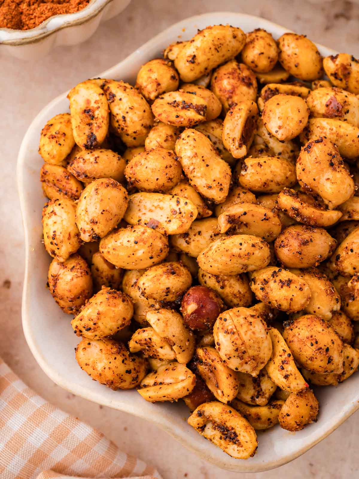 Up close of spiced peanuts in a bowl.