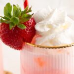 Up close of the strawberry and whipped cream in the Strawberry Cream Soda.