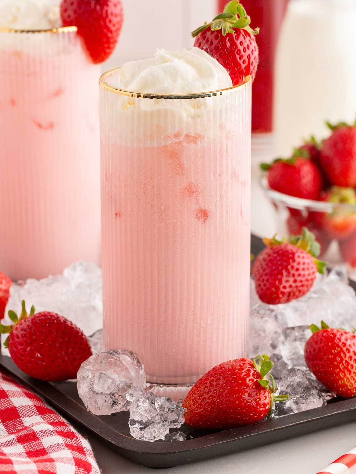 Strawberry Cream Soda with whipped cream and a fresh strawberry.