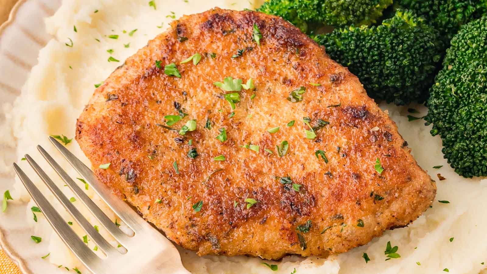 Parmesan Crusted Pork Chops by Tessie's Table.