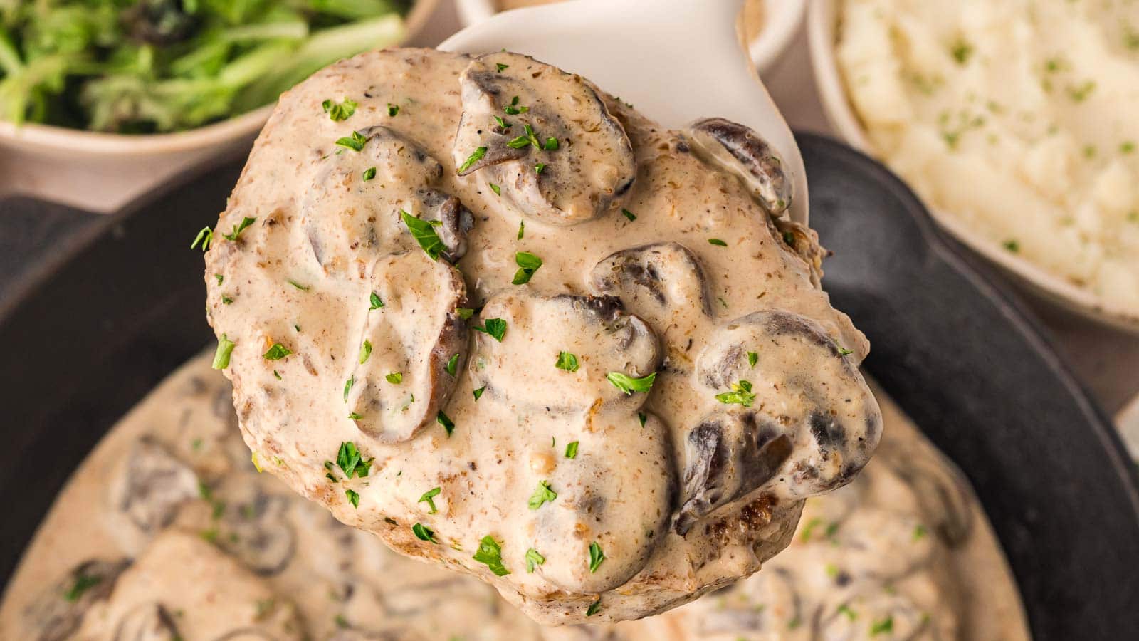 Smothered Pork Chops by Tessie's Table.