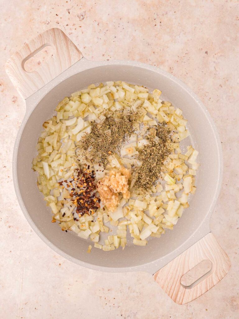 All the seasoning added to the onions frying in the pot.