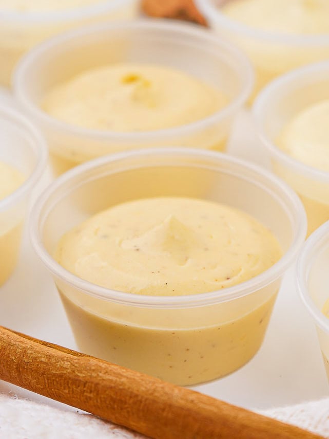 The eggnog mixture in a pudding cup.