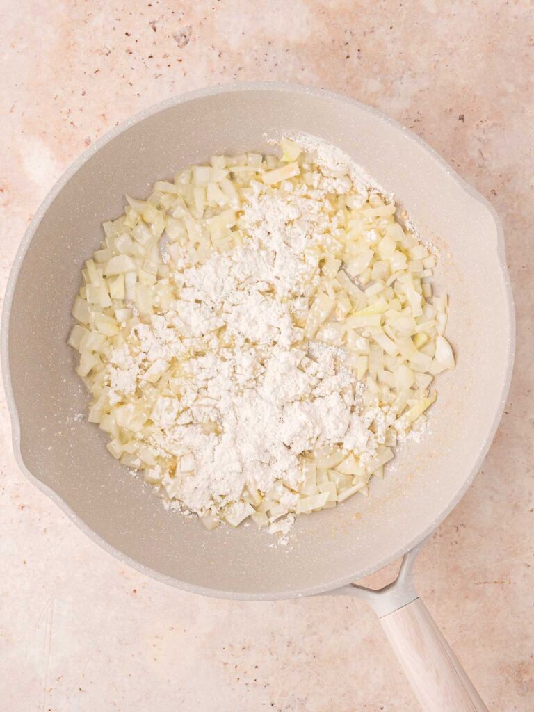 Onions and flour in a pan.