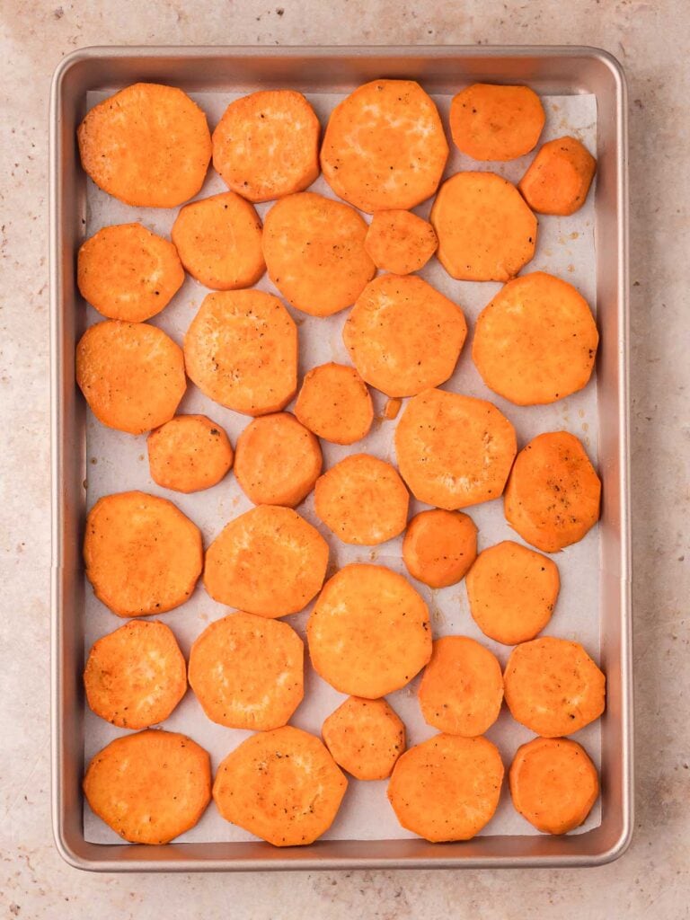 Maple Roasted Sweet Potatoes uncooked on a baking tray.