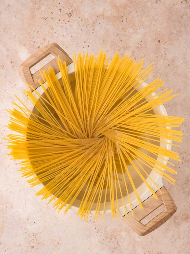 Pasta being cooked in a pot.