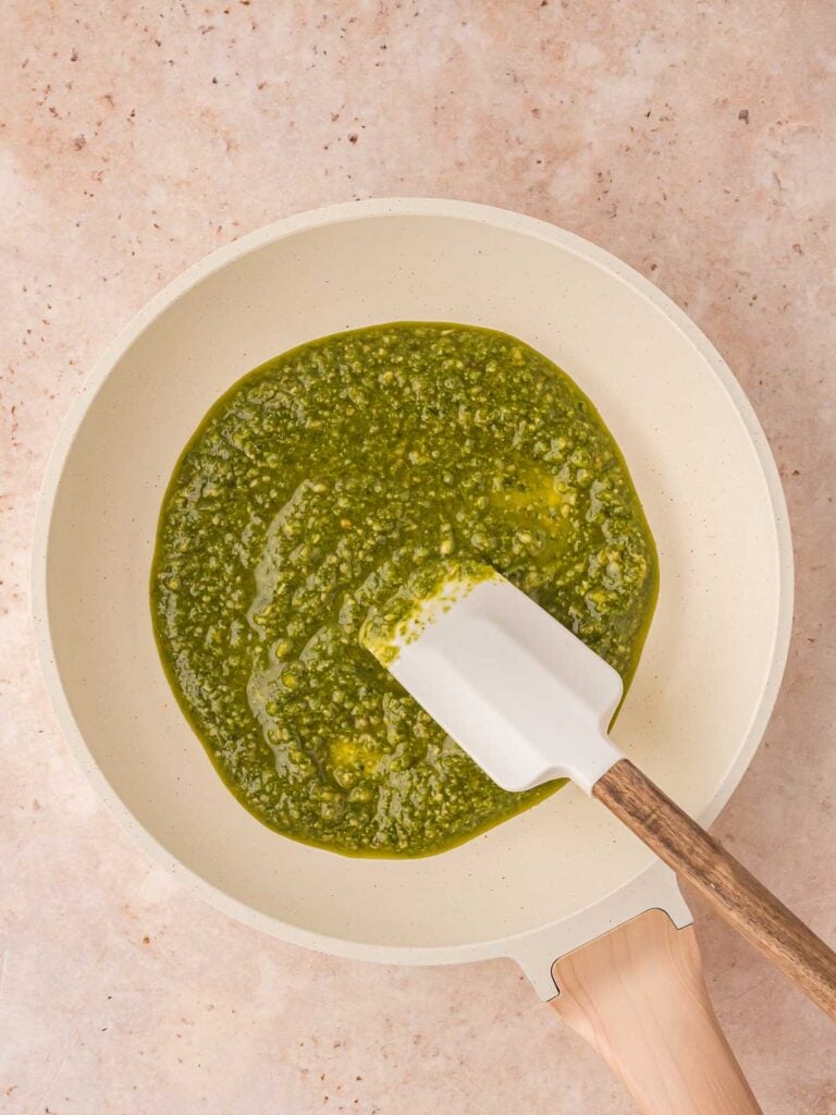 Pesto getting warmed u in a pan.