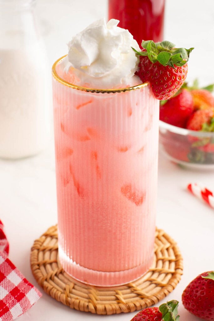 Strawberry Cream Soda with whipped cream and a fresh strawberry.