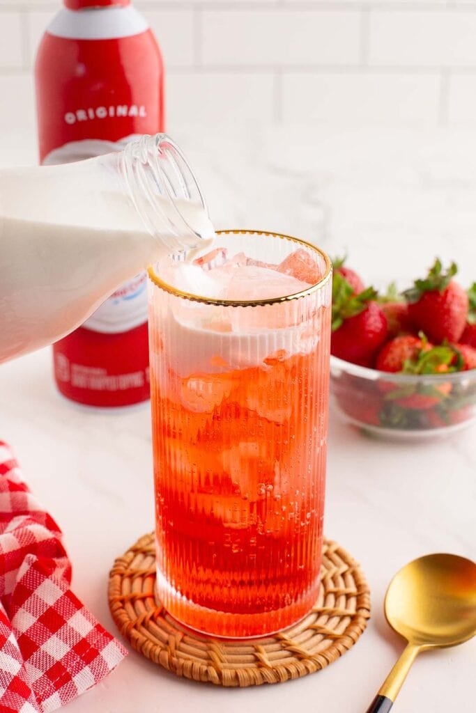 Pouring the heaving cream into the glass.