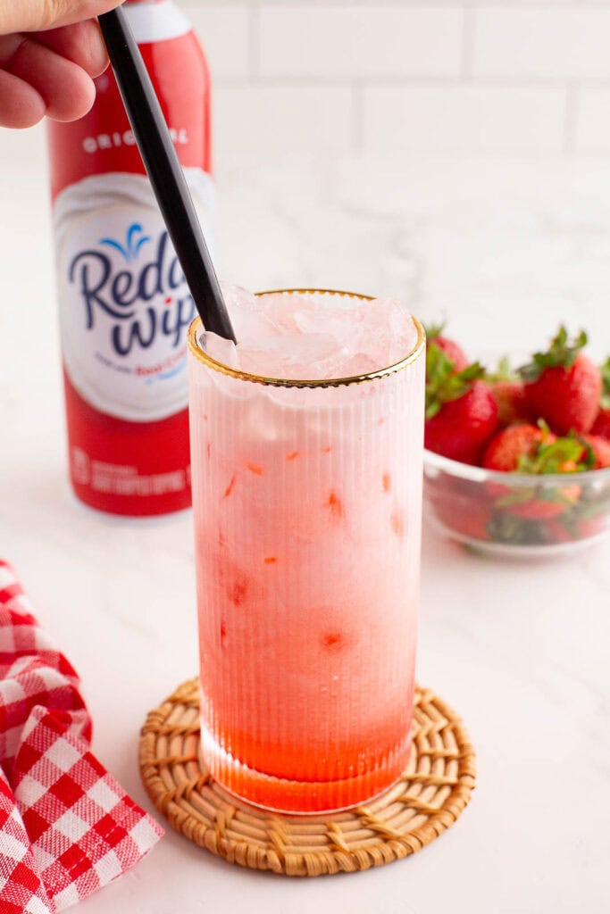 A straw mixing the drink together.