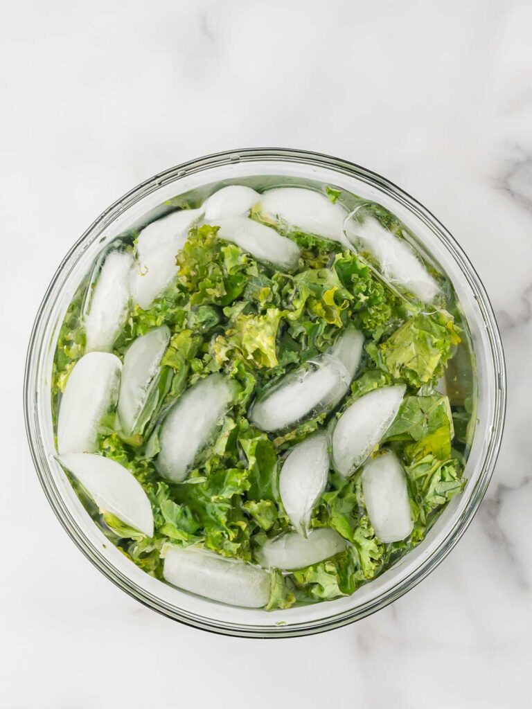 Kale in a bowl with iced water.