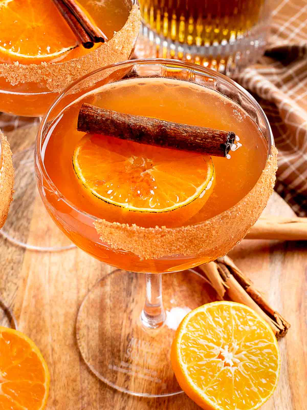 45 degree photo of Orange Cinnamon Old Fashioned on a wooden tray.