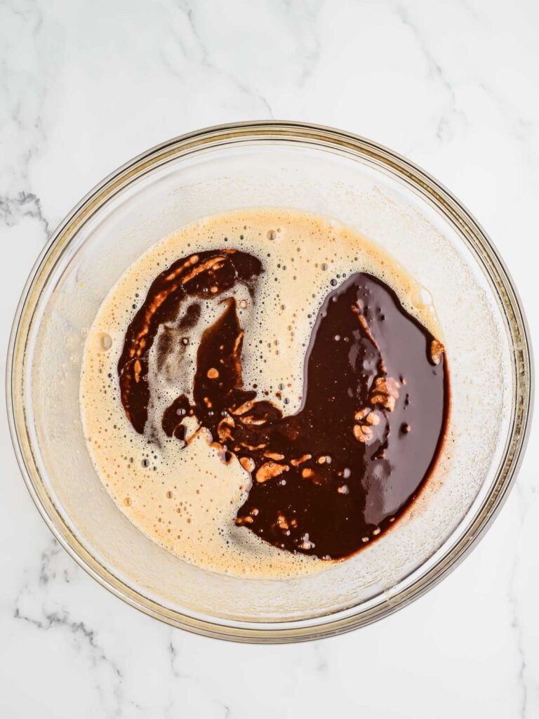 Cake batter being mixed with buttermilk.