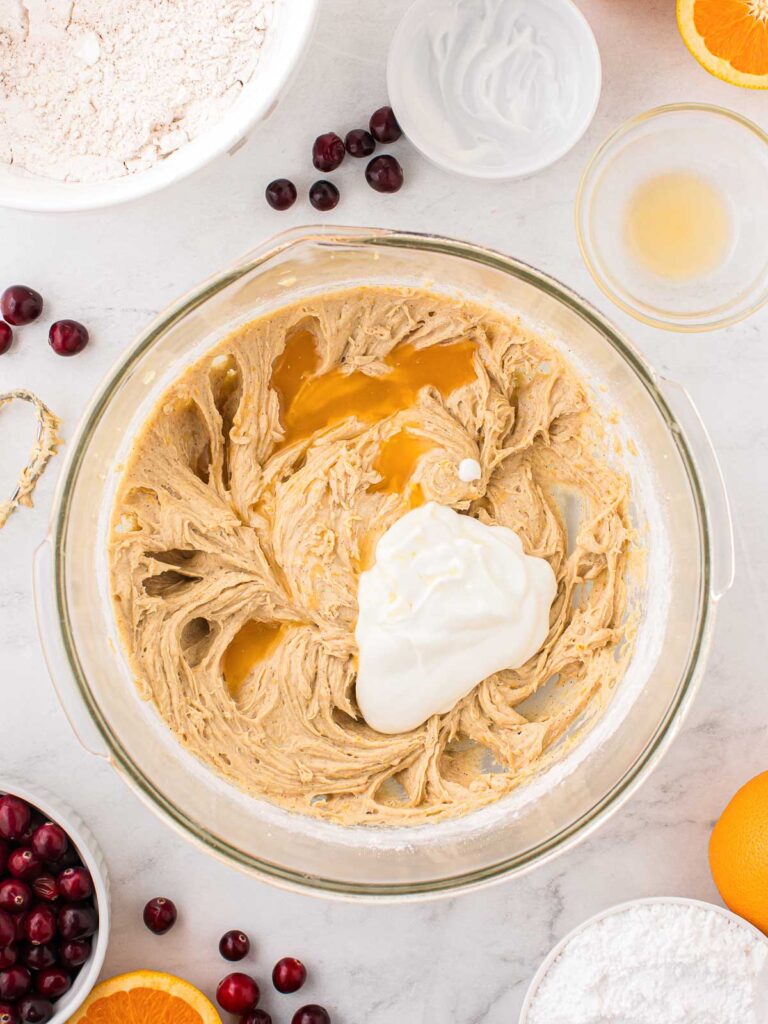 Greek yogurt in a bowl with the batter.