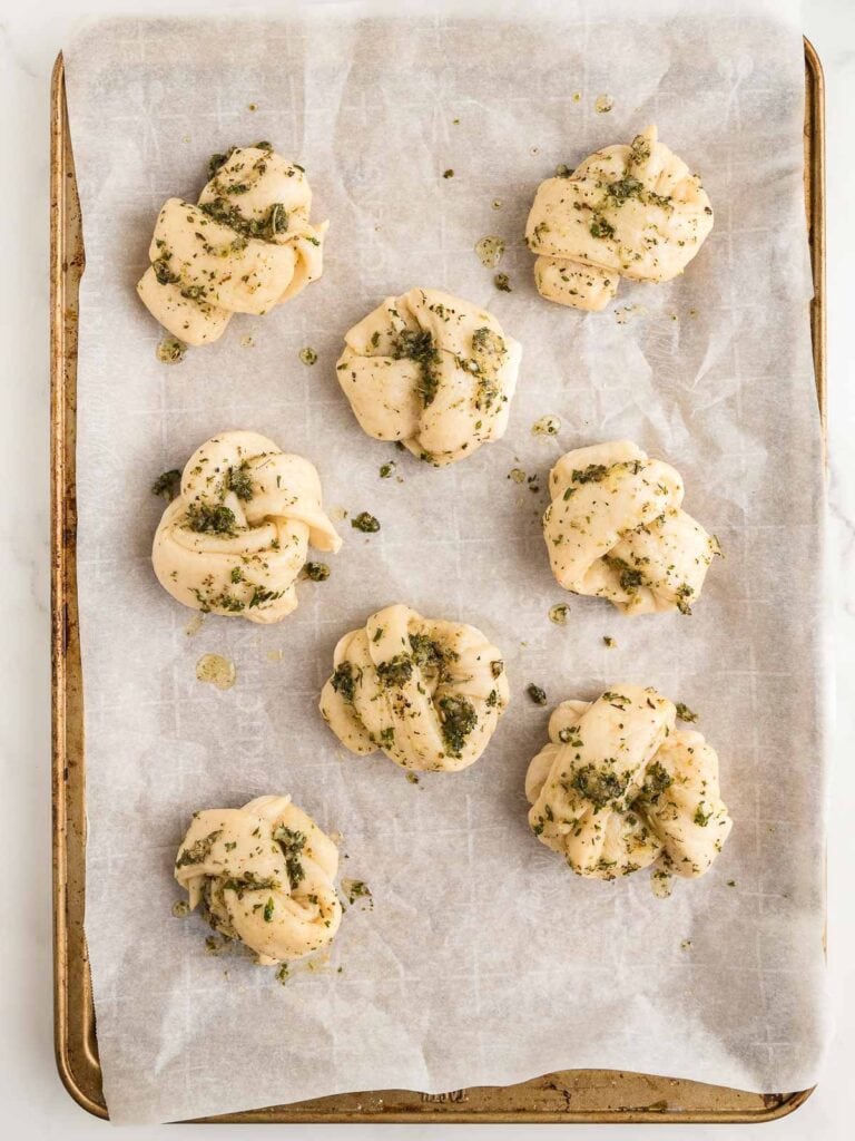 Garlic mixture on top of Homemade Garlic Knots.