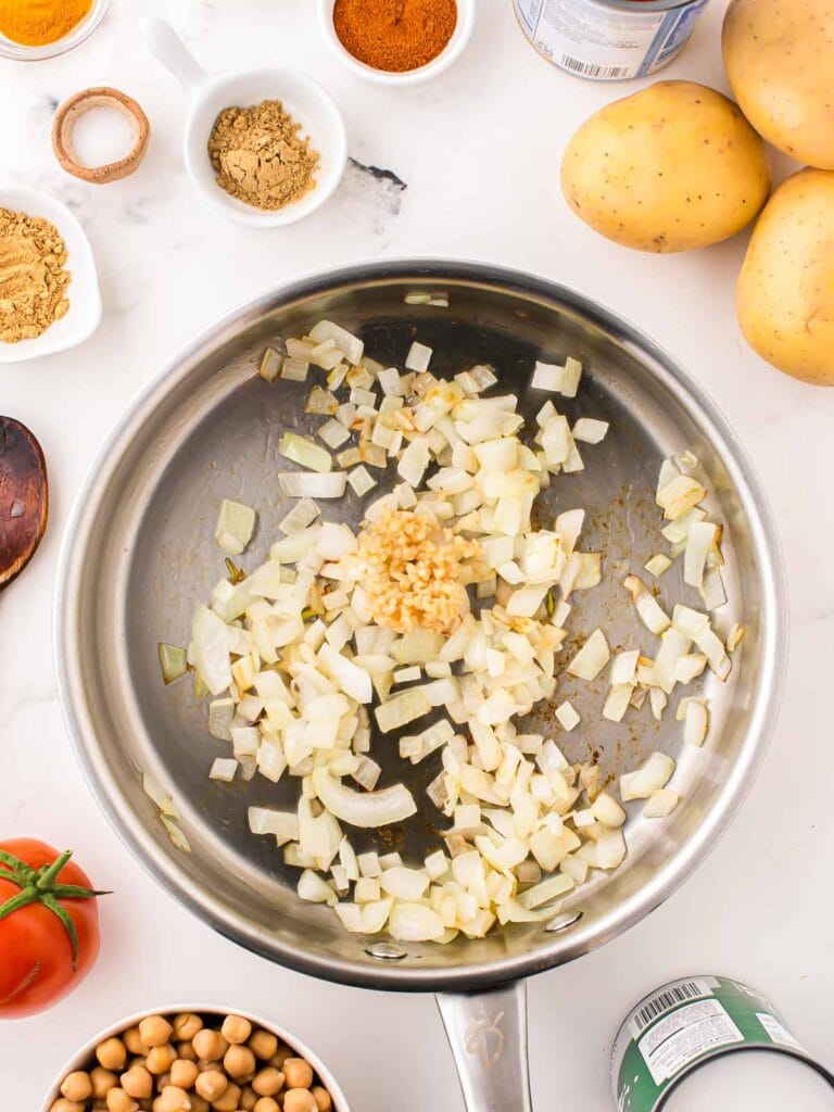 Onion and Garlic in a frying pan.