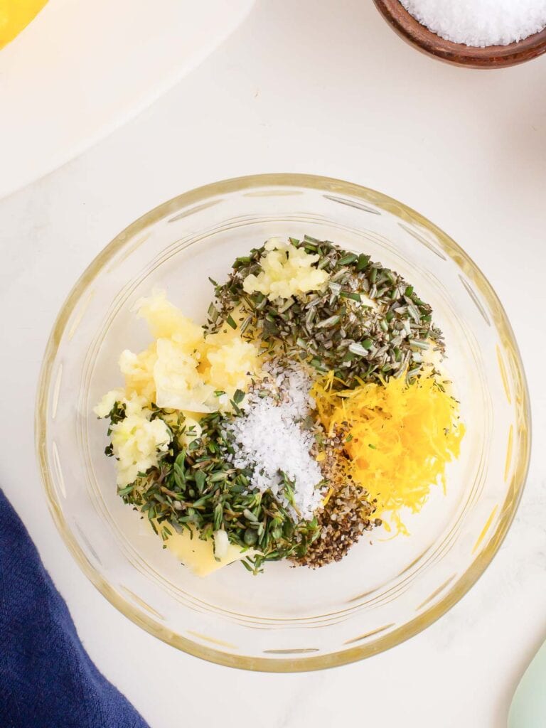 A butter and herb mixture in a bowl.