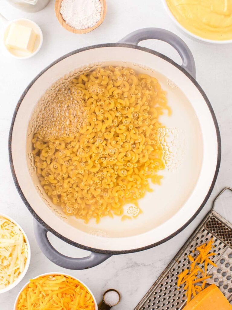 Cooked elbow pasta in a pot.