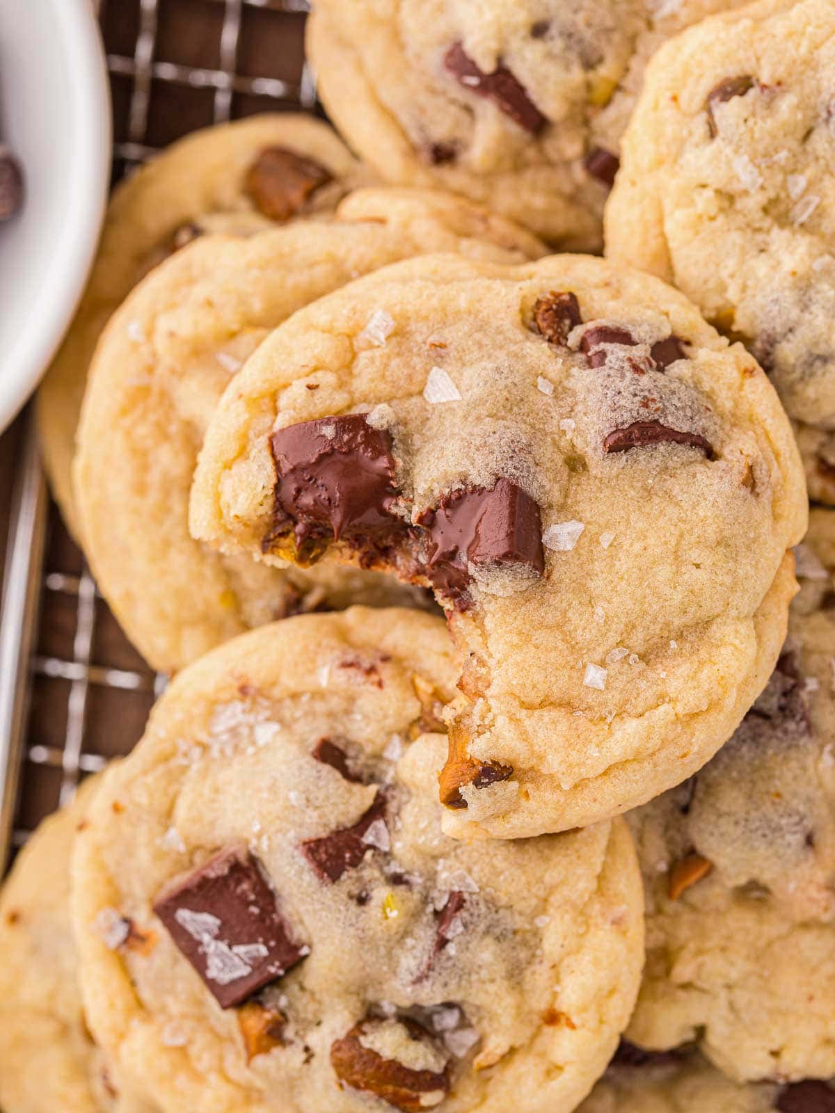 A Pistachio Cookie with a bite taken off.