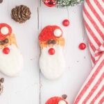 Up close of a Santa Nutter butter on a white wooden table.