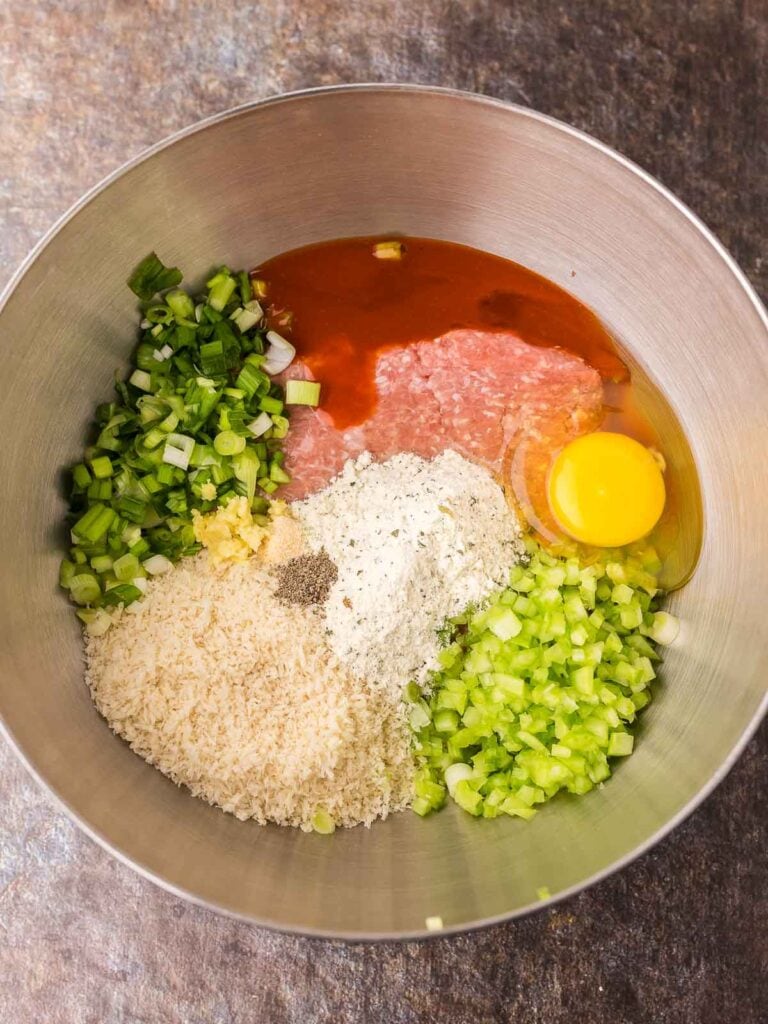 All the ingredients in a bowl to make Buffalo Chicken Meatballs.