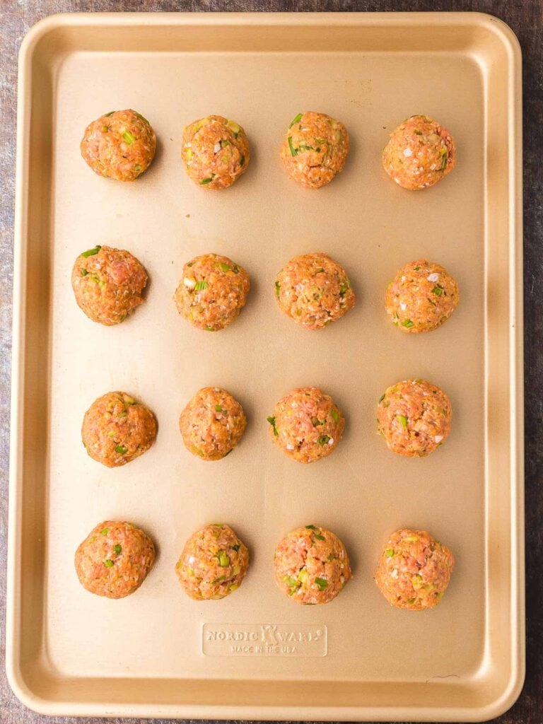 Raw Buffalo Chicken Meatballs on a tray before they get baked.