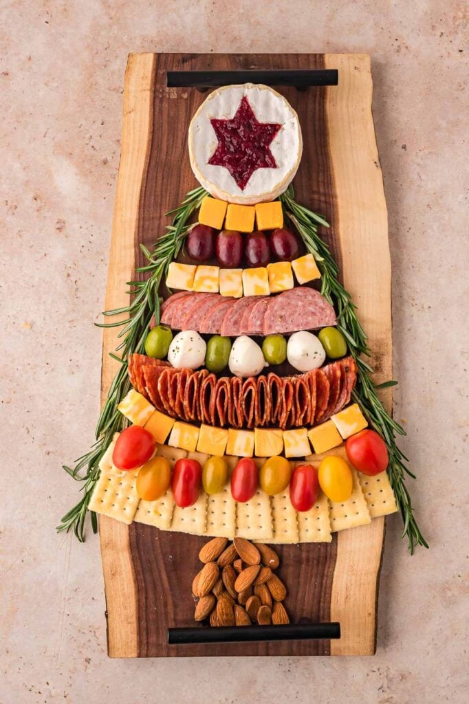 Decorated Christmas Tree Charcuterie Board with springs of rosemary.