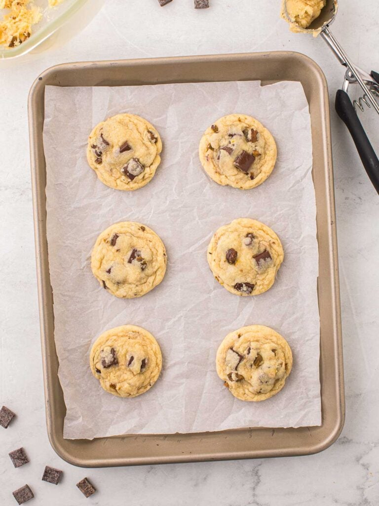 Cooked Pistachio Cookies on a cookie tray.