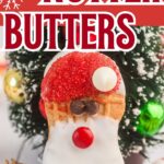 Up close of a Santa Nutter butter on a white wooden table.