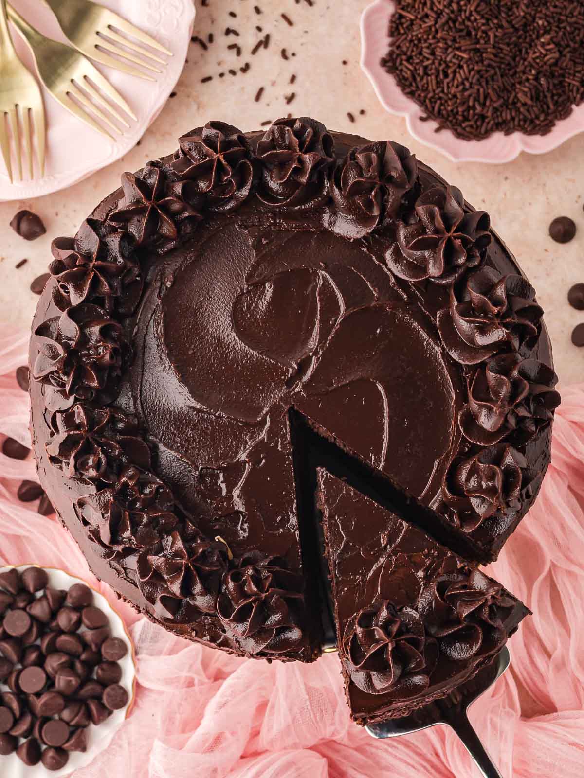 Overhead shot of a slice of cake being removed from the Double Chocolate Cake.