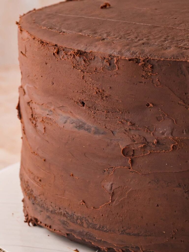 A cold crumb coat on the double chocolate cake.