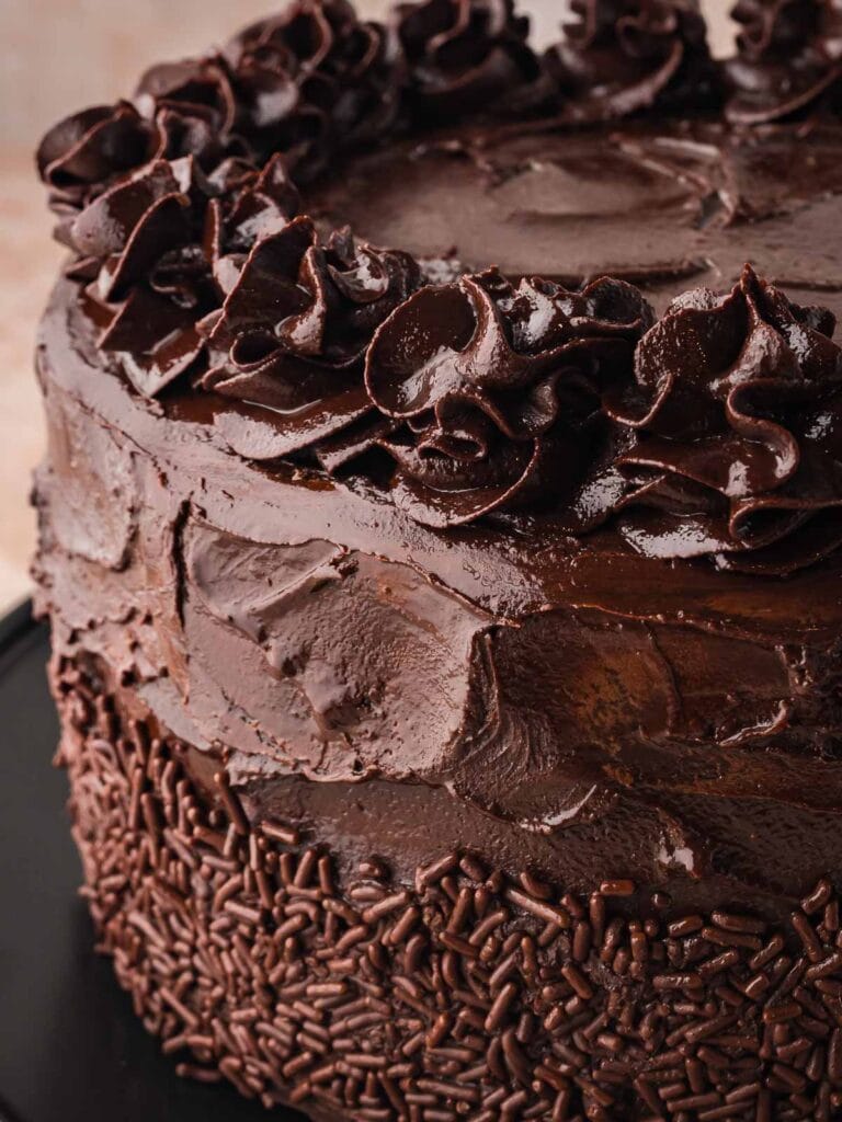 Up close of the chocolate ganache swirls on top of the double chocolate cake.