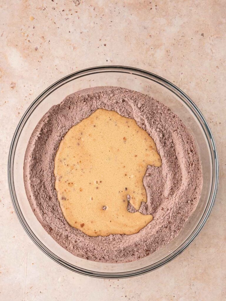 Wet and dry ingredients in a bowl.