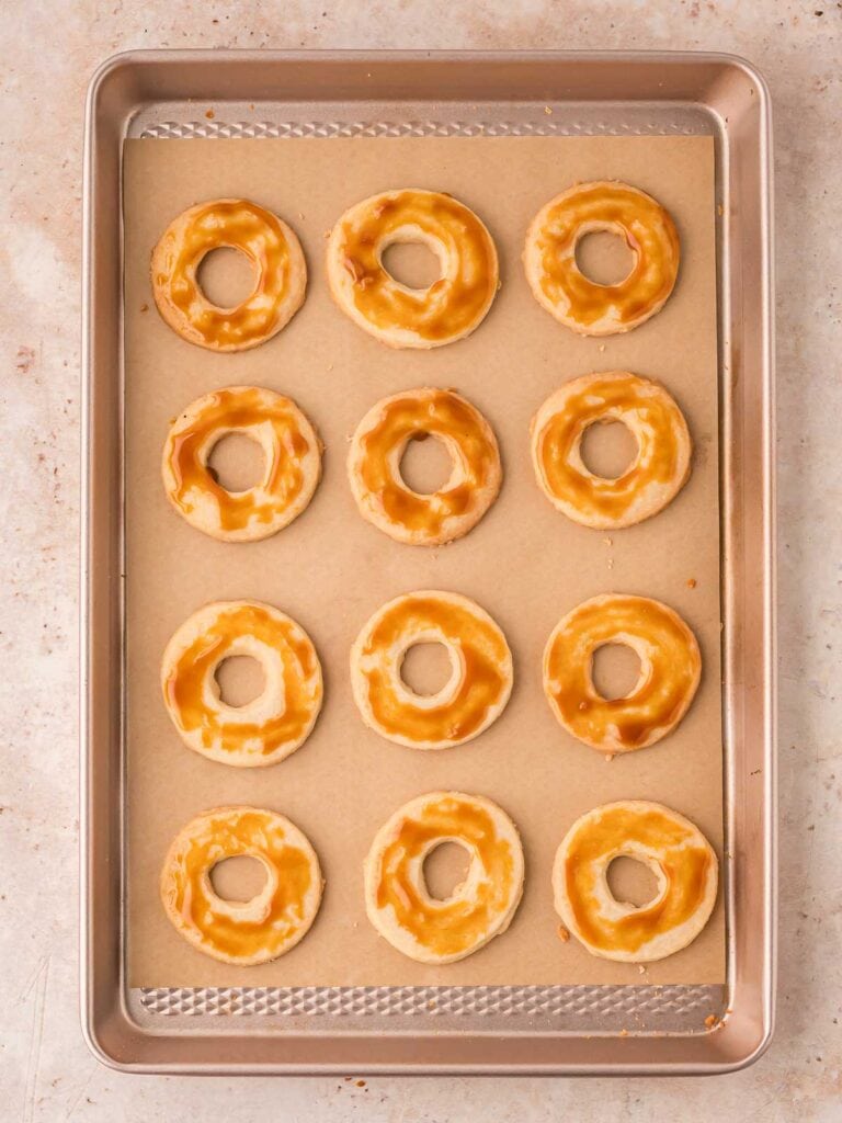 Caramel spread onto the shorbread cookies.