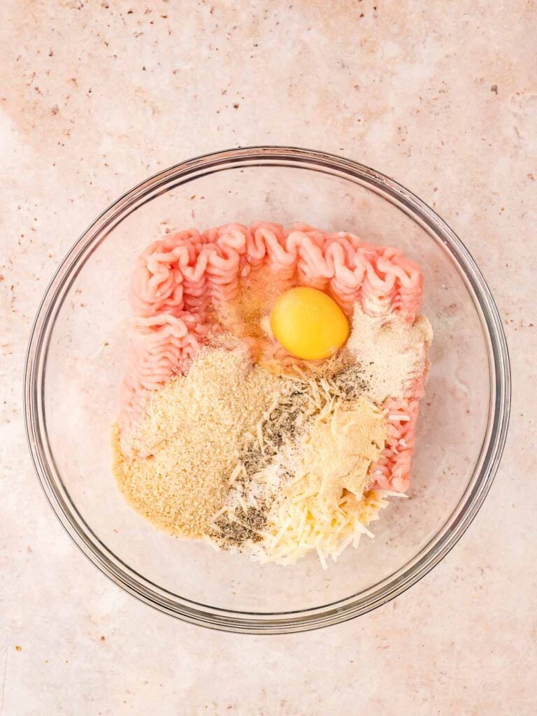 All the meatball ingredients in a bowl.